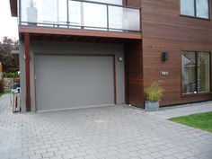 a house with a large garage in front of it