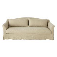 a white couch with two pillows on it's back and one arm folded up