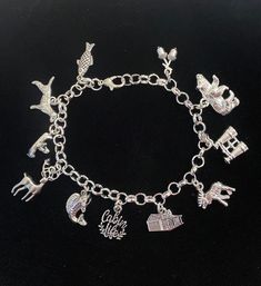 New. This Bracelet makes a perfect gift. Has  11 Cabin Life Themed Charms all charms are approx 1/2" to 1" in size Stainless Steel bracelet has a lobster clasp closure and is adjustable measures approx 8" bracelet is Stainless Steel  charms are silver tone alloy and steel. (Nickel and lead free) Charms include small fish, dog, person on canoe, deer, trout fish, cabin life charm, log cabin, moose, binoculars, Bear, acorns Adjustable Novelty Charm Bracelet, Novelty Charms Bracelet Jewelry, Novelty Jewelry Charms Bracelet, Adjustable Novelty Charm Bracelet With Lobster Clasp, Silver Novelty Charm Bracelet With Lobster Clasp, Adjustable Sterling Silver Charm Bracelet With Lobster Clasp, Themed Bracelet With Lobster Clasp, Adjustable Themed Charms Jewelry, Adjustable Themed Metal Charms