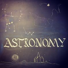 the word astronomy written in chalk on a blackboard with stars and houses around it