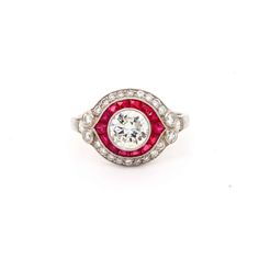 Exclusive 0.91ct Ruby and diamond target cluster ring mounted in platinum. Contemporary.  The central old round diamond surrounded by a calibre cut ruby border and an outer diamond border. The central diamond weighing 0.91ct approximately I/J colour SI1 clarity.  Total diamond weight approximately 0.60cts. Total ruby weight approximately 0.30cts. Handmade in the UK. Ruby Birthstone Ring, Target Ring, Ruby Diamond Engagement Ring, Ruby Diamond Ring, Engagement Rings Sale, Emerald Cut Diamond Ring, Floral Engagement Ring, Ruby Birthstone, Colored Engagement Rings