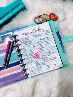 a planner with scissors and other items on it