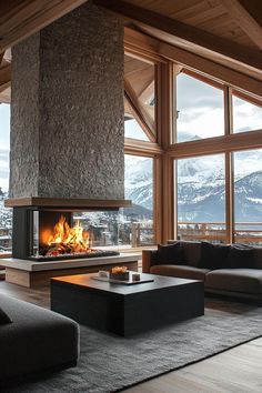 a living room filled with furniture and a fire place in front of a window covered in snow