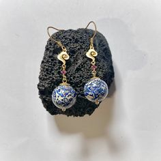 This exquisite handmade pair is a true art of Chinese lacquerware (pronounces as "Daqi Luódiàn" in Chinese). The bead charm is crafted with extreme patience and carefulness, using traditional techniques passed down through generations.  The completion of each bead involves a long process that includes natural drying periods between every two steps. This meticulous process can take anywhere from three to twelve months to achieve a fully finished product. [Material]: Wood, mother-of-pearl and gold Artisan Czech Glass Beaded Round Earrings, Artisan Czech Glass Round Bead Earrings, Artisan Jewelry With Matching Round Bead Earrings, Handmade White Beaded Brass Earrings, Spiritual Czech Glass Earrings For Jewelry Making, Handmade Spiritual Czech Glass Earrings, Artistic Handmade Jewelry For Festive Occasions, Gift Brass Beaded Earrings With Round Beads, Traditional Czech Glass Round Beads Jewelry