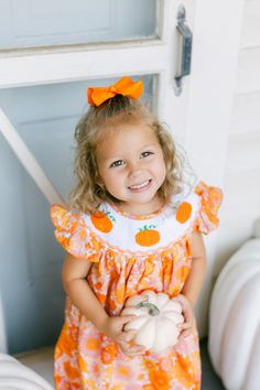 Look no further for the perfect fall smocked outfits for you little girl- this whimsical floral pumpkin dress is going to make your little pumpkin the cutest in the patch! Perfect for fall festivals and pumpkin patches Created with an adorable orange floral fabric Handstitched smock plate featuring orange pumpkins Ruffle cap sleeves with orange stitching Cotton/polyester blend Available in sizes 18 months through 6 Smocked Outfits, Pumpkin Dress, Fall Festivals, Floral Pumpkin, Pumpkin Patches, Changing Leaves, Orange Pumpkin, Smocked Dress, Fall Festival