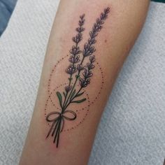 a tattoo with lavenders on the arm