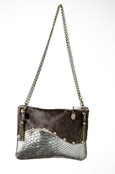 "Our handmade leather silver and brown wavy crossbody handbag is 100% leather.  It is a small size bag and has a long adjustable metal chain. It is possible to wear it longer or shorter and it will be your best friend for nights out or everyday wear. It's a small size, elegant and practical.  Color Front : Brown & Silver Color Back : Brown Detail :     100% Cow and Lamb Leather     Zip 20cm/7.8\"      H: 17cm/6.6\" W: 22cm/8.6\"      Adjustable Metal Chain: 130cm/51     Old Coins from Burma" Silver Shoulder Clutch For Everyday Use, Silver Leather Clutch Shoulder Bag, Silver Crossbody Clutch For Daily Use, Brown Leather Clutch With Chain Strap, Silver Leather Shoulder Bag As Gift, Silver Leather Shoulder Bag For Gift, Brown Leather Bag, Old Coins, Brown Silver