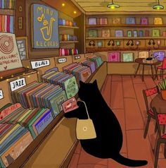 a black cat sitting on top of a counter next to a book store filled with books