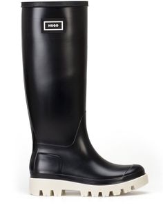 The Hugo Athena Ladies Wellies are a must-have for any woman's shoe collection. These black Wellington boots feature a stylish design and are made with high-quality rubber that provides durability and longevity. The boots are perfect for any outdoor activity, whether it's gardening, walking the dog, or enjoying a festival. The boots come in a size UK 6 and are designed specifically for women. The Wellington boots have a comfortable fit and are easy to wear. The boots have a brand name of Wellington and are characterised by their unique style. These boots are perfect for outdoor activities and are a great addition to any woman's shoe collection. Ladies Wellington Boots, Leather Knee-high Waterproof Boots For Outdoor, Black Waterproof Knee-high Boots, Black Knee-high Waterproof Boots For Outdoor, Ladies Wellies, Wellington Boot, Dog Walking