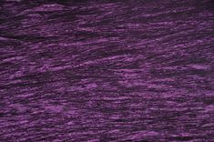 an abstract purple background with wavy lines