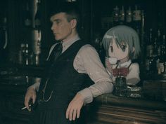 a man standing in front of a bar with an anime character on it's back