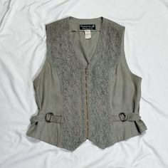 Vintage 1970s/1980s sleeveless vest in grey. In good condition. Note: I try to match colors as much as possible to pictures but there is a possibility it won't be an exact match. Unless the color is completely incorrect I am unable to offer refunds for this reason. Size: 10, fits like a medium Brand is Hampton Dress Co. Measurements (taken on garment laid flat): Armpit to armpit: 19.5" Waist: 37" (can be tightened) Armpit to hem: 9" Length (top of neck to bottom hem): 22.5" Fabric: unable to rea Vintage Sleeveless Tank Top For Fall, Gray Cotton Vest For Spring, Fitted Gray Sweater Vest For Spring, Vintage Sleeveless Sweater Vest For Spring, Hamptons Dress, Match Colors, Grey Vest, Vest Outfits, Casual Tank Tops