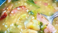 a close up of a bowl of soup with meat and vegetables