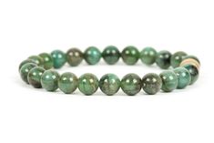 "Natural Emerald stacking bracelet. The bracelet is made with 8mm genuine Emerald round beads. Emerald is the birthstone for the month of May. You can also select to have the bracelet made with 10mm gemstone beads, which will be the last option under 'Material'. Please select the bracelet size at checkout To determine the correct size of the bracelet measure the wrist, at the smallest part of the wrist, between the hand and the wrist bone. To measure your wrist you can use a flexible measuring t Hypoallergenic May Birthstone Bracelets, Hypoallergenic May Birthstone Bracelet, May Birthstone Gemstone Bracelets With Round Beads, Healing Beaded Bracelets For May Birthstone, Adjustable Green Gemstone Beaded Bracelets, Green Gemstone Beaded Bracelets For May Birthstone, May Birthstone Hand-strung Round Bead Bracelets, Green Faceted Beaded Bracelets For May Birthstone, Green Multi-stone Bracelets For Gifts