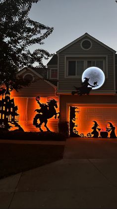 a house decorated with halloween decorations and lights