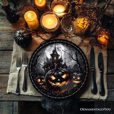 a table topped with a plate covered in halloween decorations