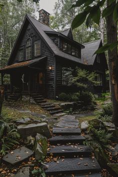 a house in the woods with steps leading up to it