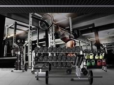 a woman is doing squats on a bench in a gym with dumbbells