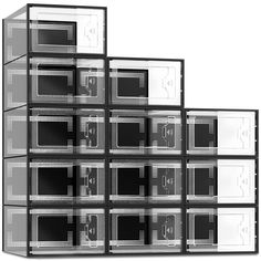 several black and white microwaves stacked on top of each other in front of a white background