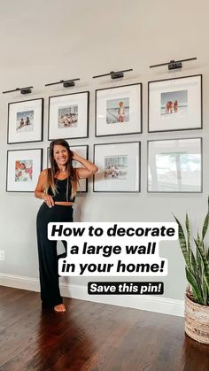 a woman standing next to a wall with pictures on it and the words how to decorate a large wall in your home save this pin