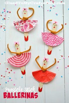 three paper dolls made to look like they are dancing