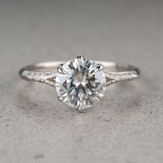 a white gold engagement ring with a round cut diamond