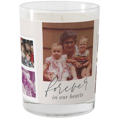 a candle with an image of a woman and two children on it