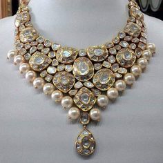 Luxury Bollywood Kundan Diamond Necklace, Luxury Heavy Kundan Necklaces, Luxury Kundan Statement Jewelry, Luxury Bollywood Kundan Necklace For Puja, Luxury Oxidized Kundan Necklace For Wedding, Luxury Heavy Antique Kundan Necklace, Luxury Temple Jewelry Style Choker With Cutdana, Luxury Dual-tone Gold Kundan Necklace, Luxury Kundan Necklace For Reception With Round Beads