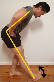 a man standing in front of a white wall with yellow lines on it