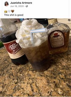 two drinks sitting on top of a counter next to bottles of liquor and ice cream