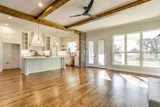 a large open floor plan with wood floors