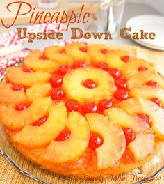 a pineapple upside down cake on a plate with the words, pineapple upside down cake