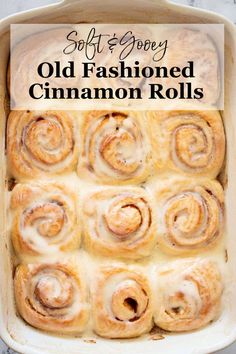 an old fashioned cinnamon roll in a baking dish with the title overlay reading soft & chewy old fashioned cinnamon rolls