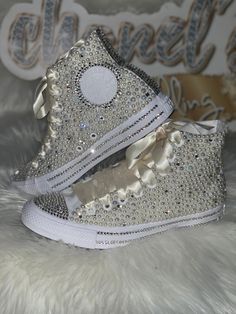 Custom Bling Converse All Star Chuck Taylor Sneakers. All designs handmade and embellished with a variety of high quality crystals. Great for weddings, proms, homecomings, birthdays, special events or just your everyday girly girl. **IF YOU NEED THIS ITEM BEFORE THE PROJECTED SHIPPING TIME YOU MUST CONTACT US BEFORE ORDERING (additional charges may apply) ** Shoe Details: Ivory high top Converse All Star Chuck Taylor Sneaker (Canvas Material) Shoe Size: Sizes stating at women's size 6 to women's Quince Heels, Bedazzled Converse, Sparkly Converse, Bridal Sneakers, Bling Converse, Ribbon Shoes, Wedding Converse, Rhinestone Crafts, Jeweled Shoes