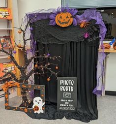 a halloween display in a store with pumpkins and decorations