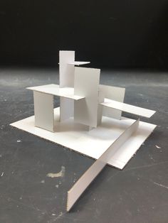 the model is made out of white cardboard