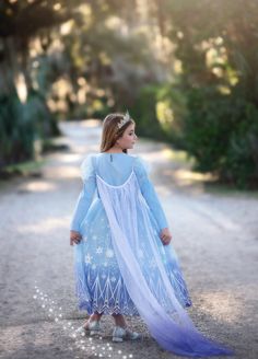 One of our most adorable Ice Queen costumes, this dress will not disappoint! The sequin bodice has a sheer sleeve, finished off with puff shoulders and sweet trim. This dress is a real gown and not a cheap plastic costume. We are never itchy and never use glitter! A tremendous value for such cuteness. Fully lined, elastic waist and back button. Machine wash, hang dry. Ice Queen Costume, Plastic Costume, Dog Size Chart, Button Machine, Queen Costume, Princess Dresses, Ice Queen, Sheer Sleeves, Shoe Size Chart