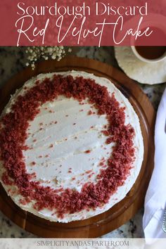 a red velvet cake with white frosting and sprinkles in the middle