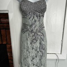 This Lace Dress Has A Beaded Sweetheart Neckline, And Beaded Leaf Detail Over The Lace Throughout The Front And Back Of The Dress. Perfect For A Wedding Guest Or Any Event. New With Tags. Never Worn. Never Altered. Excellent Condition. Kept In Shop Clear Zippered Bag. Cocktail Dress With Beaded Straps And Fitted Bodice, Fitted Lace Sequin Dress For Party Season, Embellished Lace Evening Dress For Party Season, Glamorous Fitted Sequin Lace Dress, Fitted Sequin Dress With Rhinestones And Sweetheart Neckline, Cocktail Dress With Beaded Straps And Sweetheart Neckline, Elegant Fitted Sequin Dress With Sweetheart Neckline, Formal Fitted Sequin Dress With Sweetheart Neckline, Formal Sequin Dress With Sweetheart Neckline