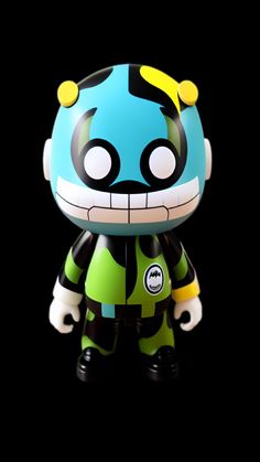 an action figure with green and black stripes on it's face, standing in front of a black background