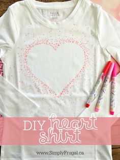 the diy heart shirt is next to markers and pens