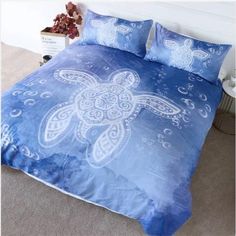 the bedding is blue and white with a sea turtle on it's back