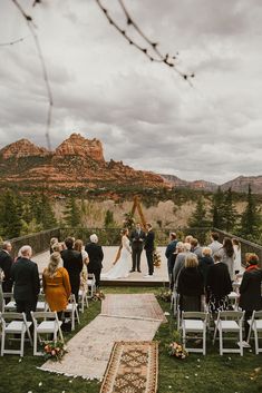 a couple getting married at the end of their wedding ceremony in sedona, colorado