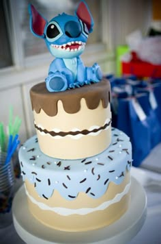 there is a cake that has been decorated with an image of stitch