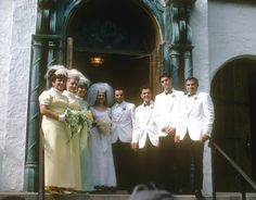 a group of people that are standing in front of a building