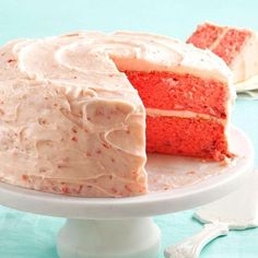 a red velvet cake with white frosting on a plate