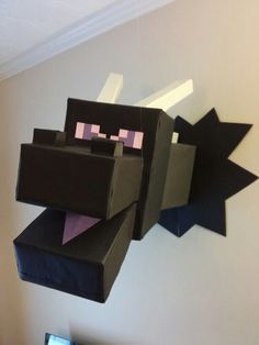 an image of a paper craft made to look like a minecraft character hanging from the ceiling