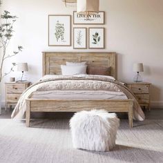 a bed room with a neatly made bed and some pictures on the wall above it