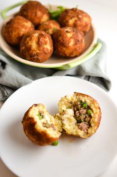 a plate with some food on it next to a bowl of broccoli and meatballs