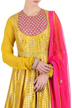 Yellow kalidar anarkali with placement sequin work and all-over foil print. Comes with embellished  pink tassel dupatta and churidar.
Components: 3 
Neckline: Round 
Sleeve Length: Full
Embroidered, Printed
Tassel detail 
Churidar sleeves  
 - Aza Fashions Unstitched Anarkali Set With Mirror Work For Festive Occasions, Festive Gold Anarkali Set With Mirror Work, Designer Semi-stitched Anarkali Set With Zari Work, Designer Anarkali Set With Mirror Work, Straight Kurta, Festive Anarkali Sharara With Mirror Work, Gold Anarkali Set With Mirror Work For Diwali, Festive Anarkali Traditional Wear With Mirror Work, Gold Anarkali Set With Mirror Work For Navratri, Designer Unstitched Anarkali Set With Mirror Work